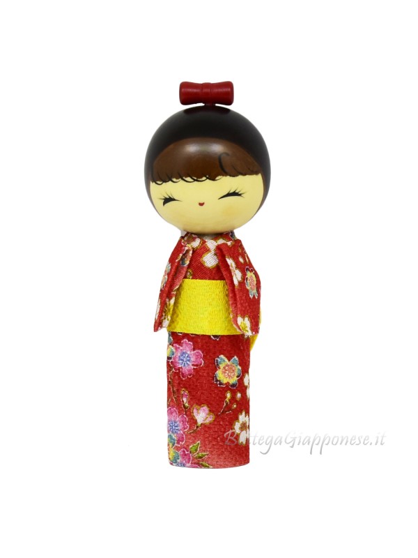 Kokeshi sorriso di ragazza con kimono